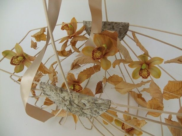 Cymbidium orchids and autumn leaves Cymbidium orchids and autumn leaves