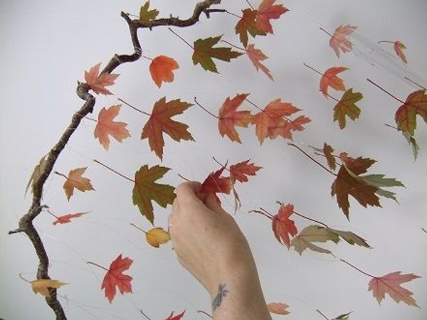 Glue leaves to all the wires and add a few leaves to the top bar hazel twig Glue leaves to all the wires and add a few leaves to the top bar hazel twig