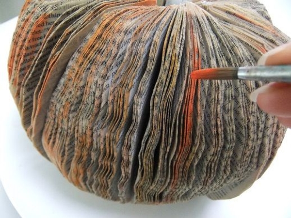 Paint a few bright orange lines to the tea soaked book Paint a few bright orange lines to the tea soaked book