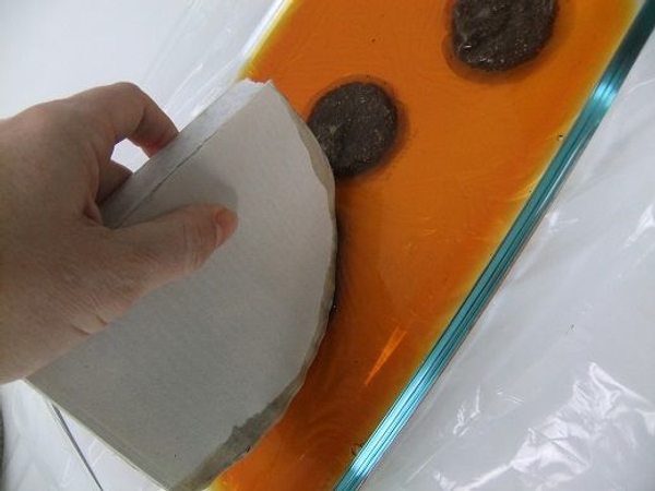 Roll the book in the tea to just soak the edges. Roll the book in the tea to just soak the edges.