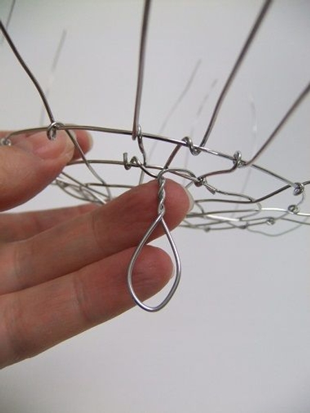 Twist the wires to the bottom of the wire armature. Twist the wires to the bottom of the wire armature.