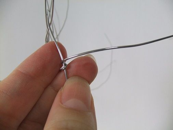 Wrap the wire around the spiral wire to secure Wrap the wire around the spiral wire to secure