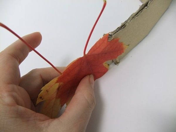 Glue on another leaf. Glue on another leaf.