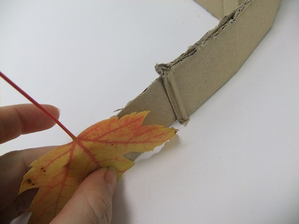 Glue the leaf to the cardboard.