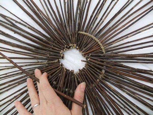 Add twigs to cover the wire all the way around Add twigs to cover the wire all the way around