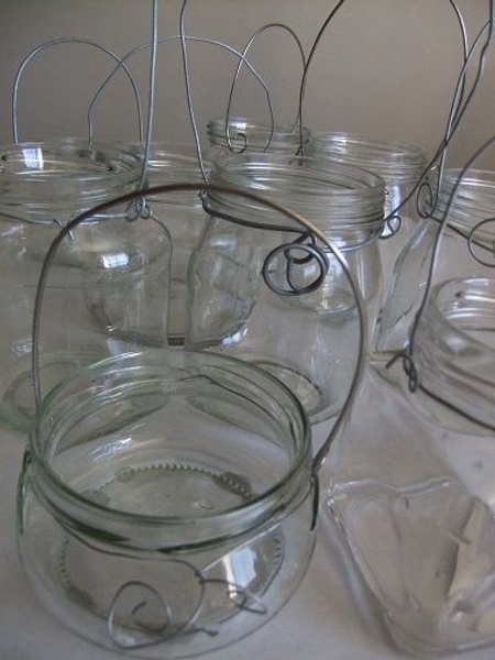 Add wire handles to recycled glass for a hanging container. Add wire handles to recycled glass for a hanging container.