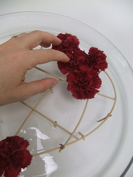 Cut the flower stems short and place it in the armature