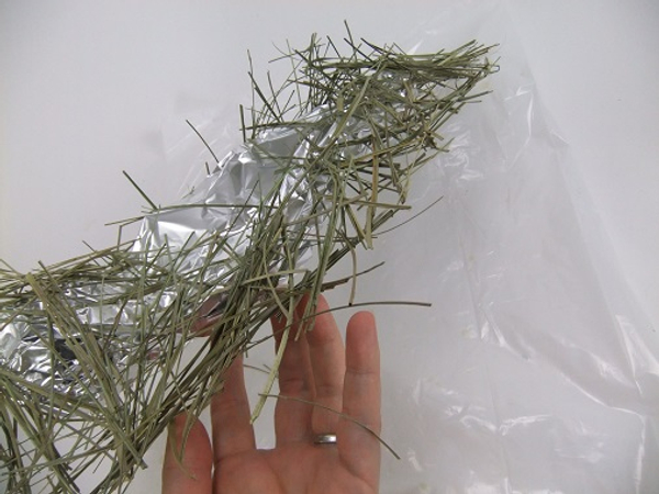 Lift the scattered grass armature from your working surface