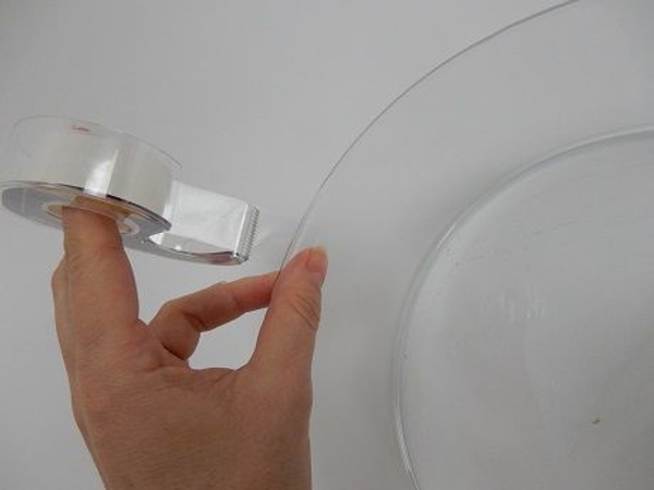 Tape from the inside out so that the sticky side faces up Tape from the inside out so that the sticky side faces up
