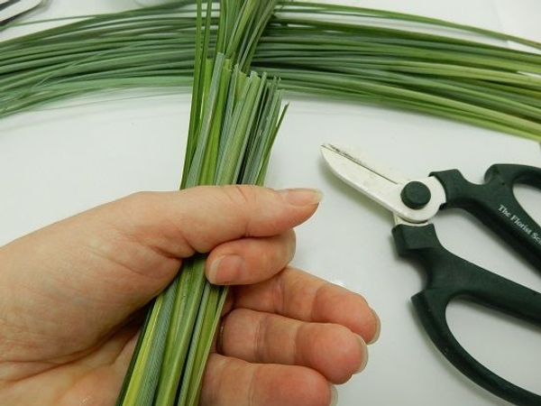 Cut grass flat at one side. Cut grass flat at one side.