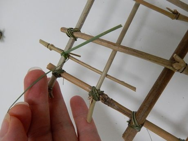 Cut two hooks from bamboo and latch it to the panel Cut two hooks from bamboo and latch it to the panel