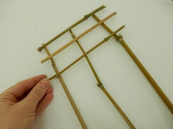 Lay the three longer pieces flat on as working surface and stack the other pieces Lay the three longer pieces flat on as working surface and stack the other pieces
