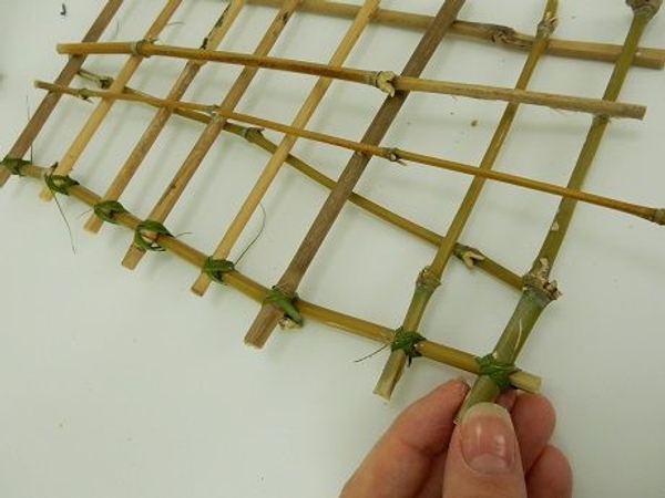 Move down the length of bamboo and latch each piece together Move down the length of bamboo and latch each piece together
