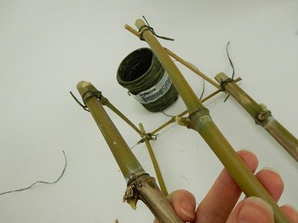 Place a bamboo piece at one side and latch Place a bamboo piece at one side and latch