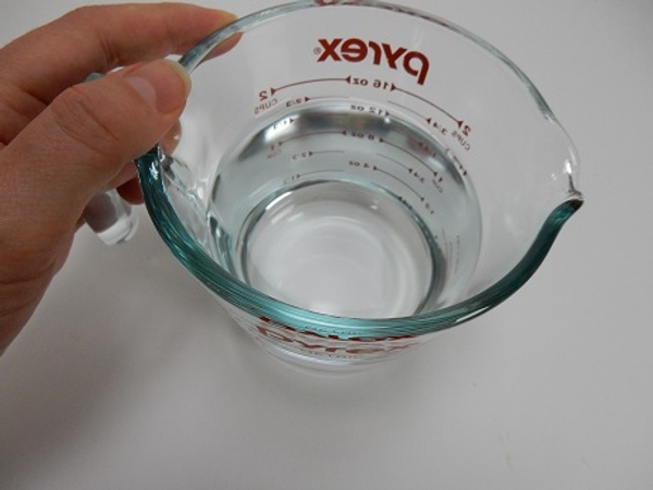 Pour about 3.5 cm of boiling water in a heat proof container Pour about 3.5 cm of boiling water in a heat proof container