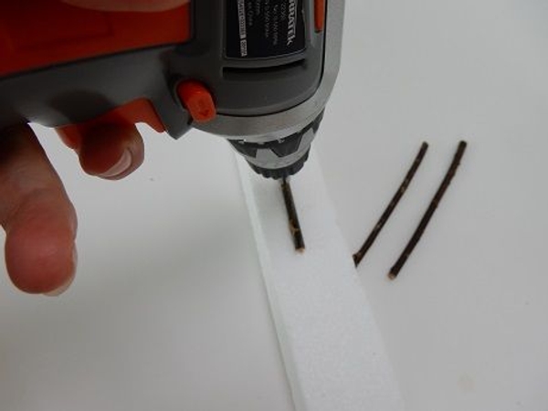 Drill five holes in three twigs Drill five holes in three twigs
