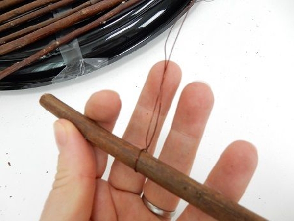 Slip the twig into the bend and twist the wire to secure. Slip the twig into the bend and twist the wire to secure.