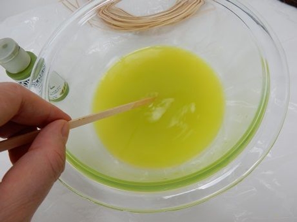Thin a small amount of water based paint with warm water Thin a small amount of water based paint with warm water