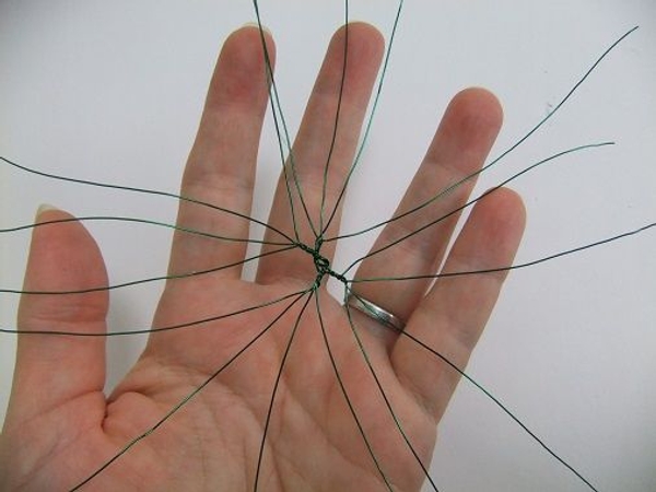 Twist eight wires together to create sixteen radiating spikes Twist eight wires together to create sixteen radiating spikes