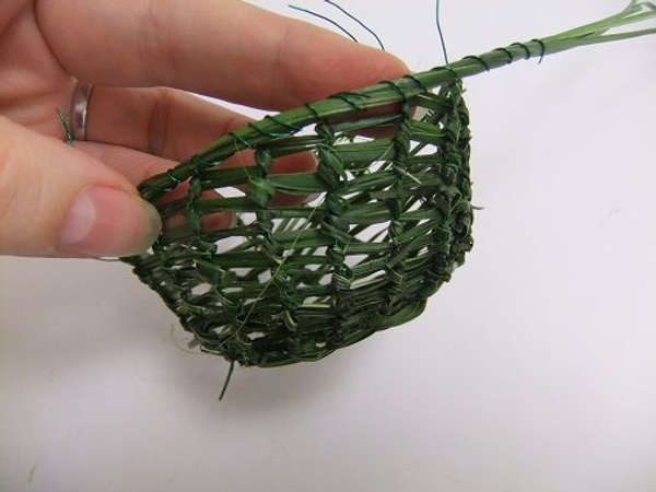 Work your way around the basket securing the strands and the wire Work your way around the basket securing the strands and the wire