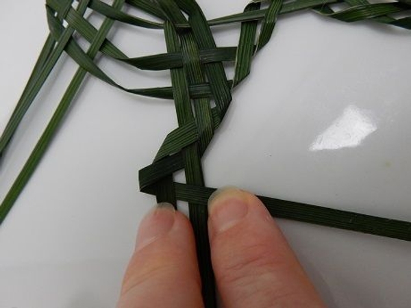 Fold the top blade under and over Fold the top blade under and over
