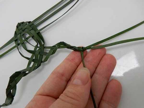 Knot the strands together to create the feet Knot the strands together to create the feet