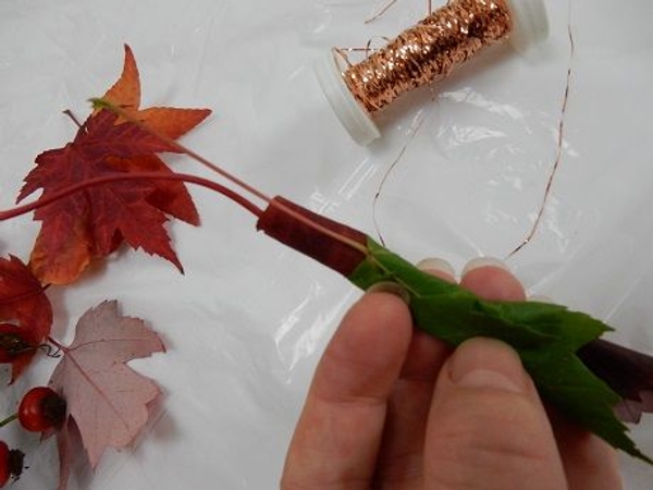 Place another leave over the first and wrap the roll Place another leave over the first and wrap the roll