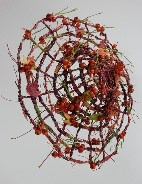 Weave the garland to spiral out to create a decorative hat Weave the garland to spiral out to create a decorative hat