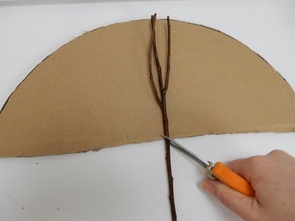 Place the cardboard on a flat working surface Place the cardboard on a flat working surface