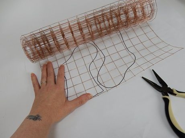 Measure out copper mesh to the size of the template. Measure out copper mesh to the size of the template.