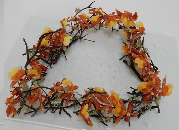 Stack twig heart, moss oncidium orchids and artificial snow Stack twig heart, moss oncidium orchids and artificial snow