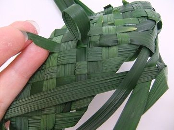 Cut the leaf to a sharp angle to make it easier to insert back into the weave of the sole Cut the leaf to a sharp angle to make it easier to insert back into the weave of the sole