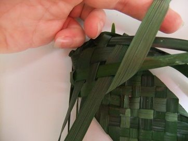 Fold the innermost leaf over to the right Fold the innermost leaf over to the right