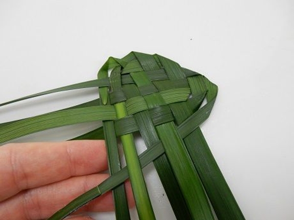Fold the last top right leaf over and then under and weave it through Fold the last top right leaf over and then under and weave it through