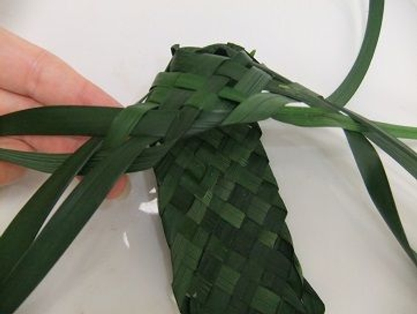 Fold the next set of leaves over and back to the sole. Fold the next set of leaves over and back to the sole.