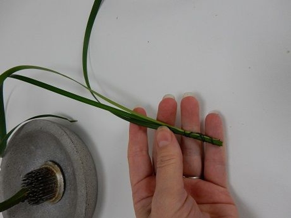 Gather a few stems together and latch with binding wire Gather a few stems together and latch with binding wire