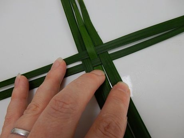 Weave in another blade of grass or palm Weave in another blade of grass or palm