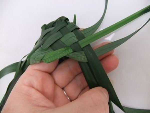 You now have two strands pointing to the heel of the slipper and three pointing to the sole You now have two strands pointing to the heel of the slipper and three pointing to the sole