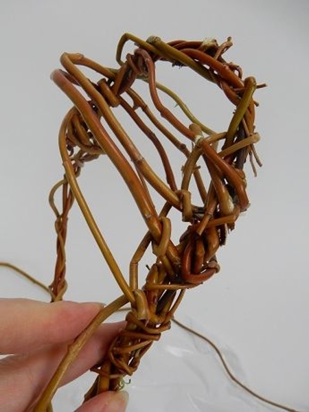 Flip the heart wand over and continue to wrap the stems on the other side Flip the heart wand over and continue to wrap the stems on the other side