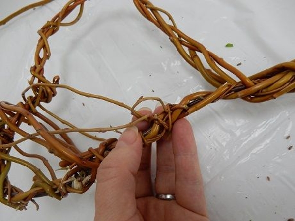 Secure a willow stem to the heart outline Secure a willow stem to the heart outline