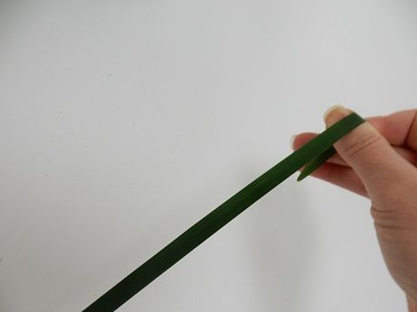 Gently pinch the blade between your fingers and pull it through Gently pinch the blade between your fingers and pull it through