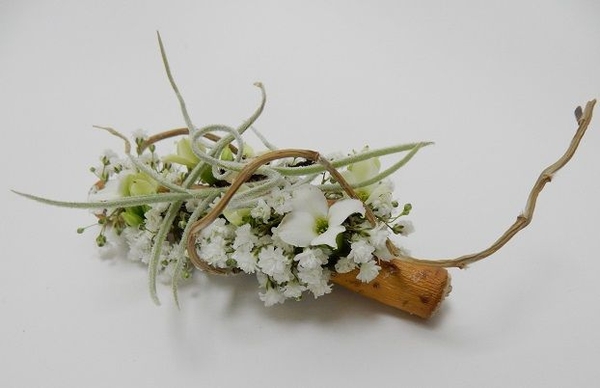 Embed a corsage magnet inside a twig