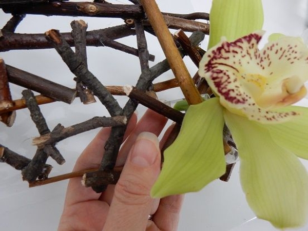 To keep my orchids and sprouting willow stems fresh I glued in tiny vials filled with water To keep my orchids and sprouting willow stems fresh I glued in tiny vials filled with water