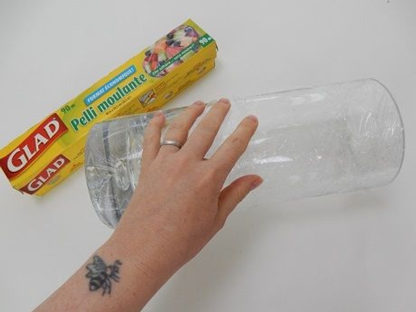 Cover a cylindrical vase with cling wrap Cover a cylindrical vase with cling wrap