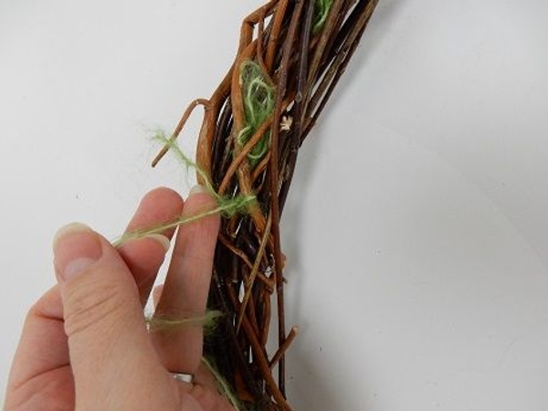 Tie wool to the wreath and secure with a knot Tie wool to the wreath and secure with a knot