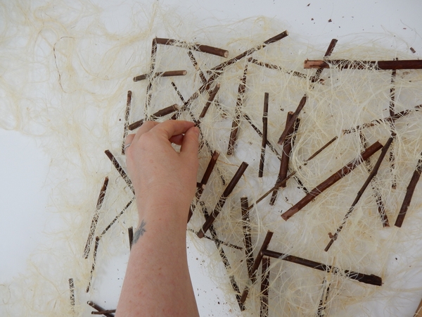 Randomly pin twigs to cross with twigs on the layers below Randomly pin twigs to cross with twigs on the layers below