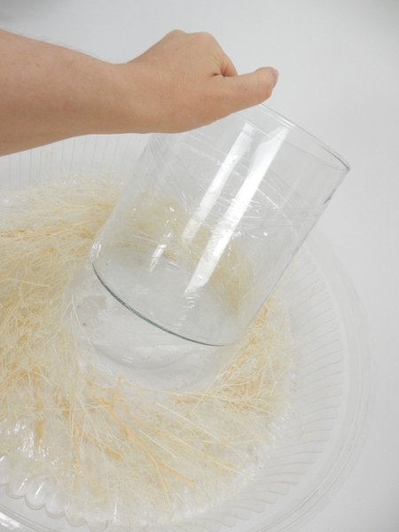 Carefully lift the pillar vase from the tray