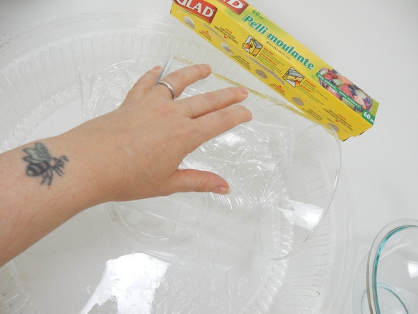 Cover the vase with cling wrap to make it easy to remove Cover the vase with cling wrap to make it easy to remove