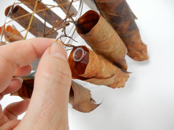 Place a tiny water source in the leaf tube for the fresh flowers Place a tiny water source in the leaf tube for the fresh flowers