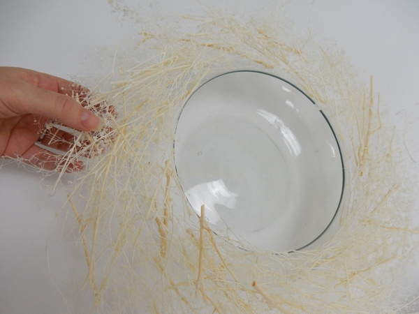 Place the wreath on a glass container Place the wreath on a glass container